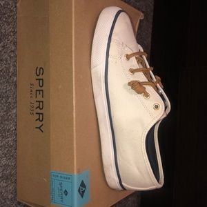 Sperrys’ in the color ivory.